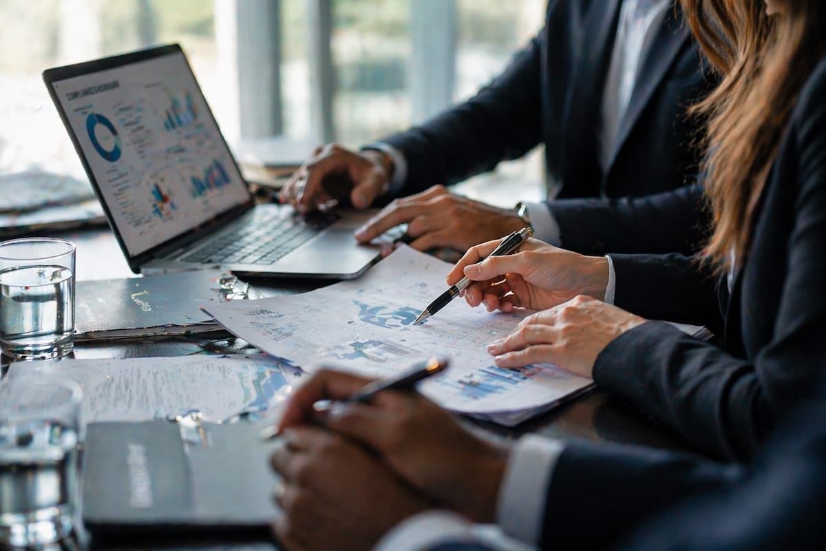Financial services team reviewing analytics data in a meeting room