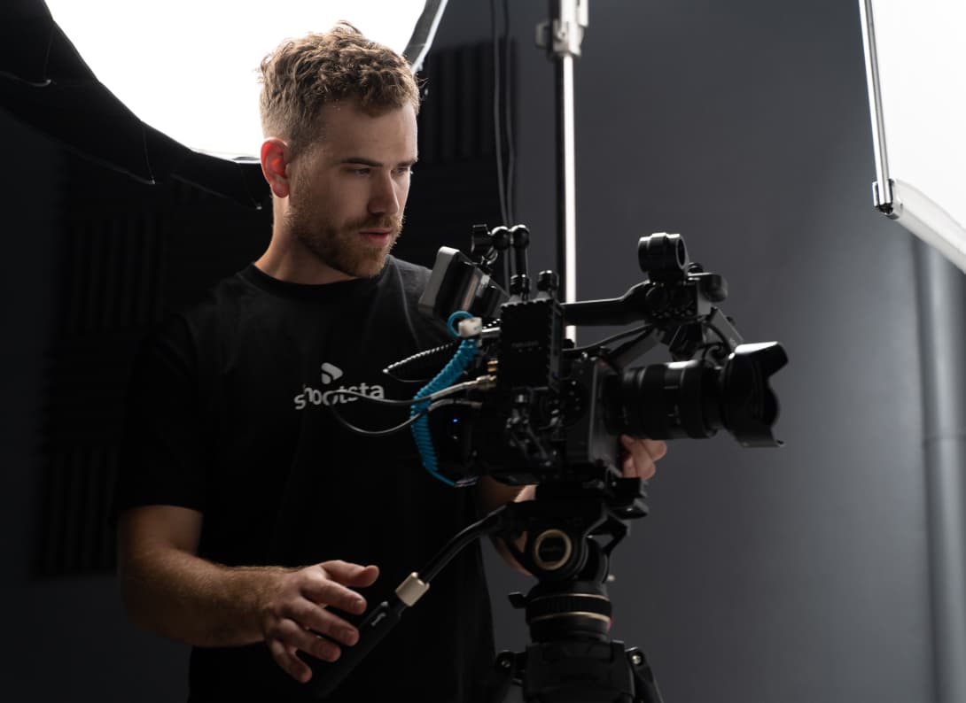 Videographer setting up a camera for a LinkedIn thought leadership video shoot